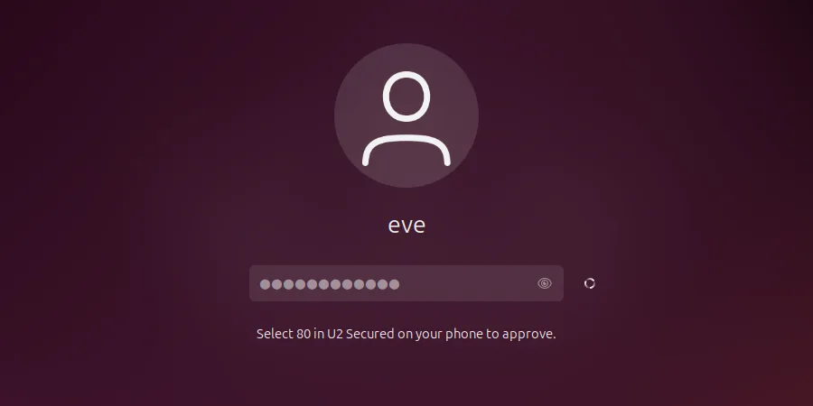 Ubuntu lock screen after the password: “Select 80 in U2 Secured on your phone to approve.”, with a spinner while it waits.